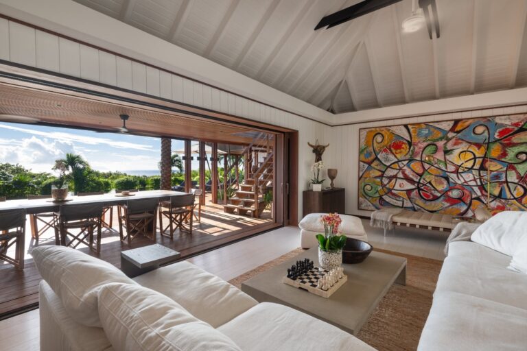 Villa Aura art-filled living room opening onto the terrace